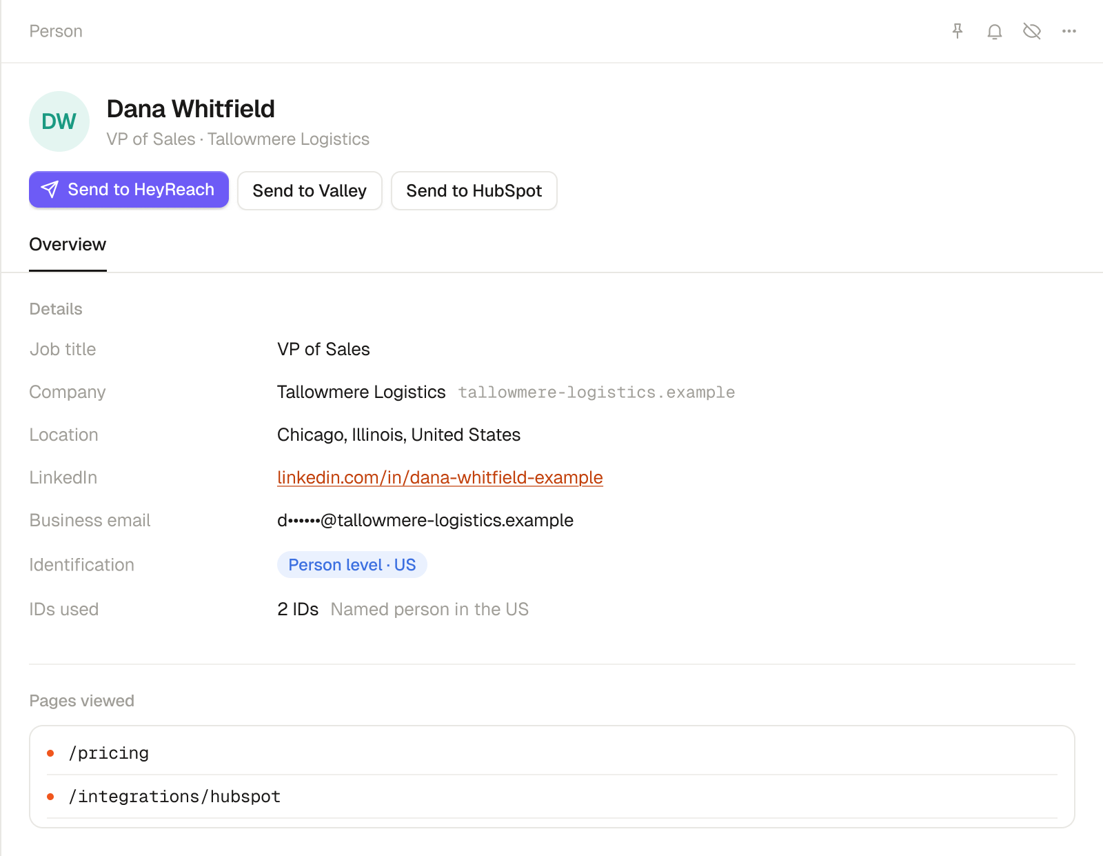Warm AI named US visitor record for Dana Whitfield, an invented example, with options to send to HeyReach, Valley or HubSpot